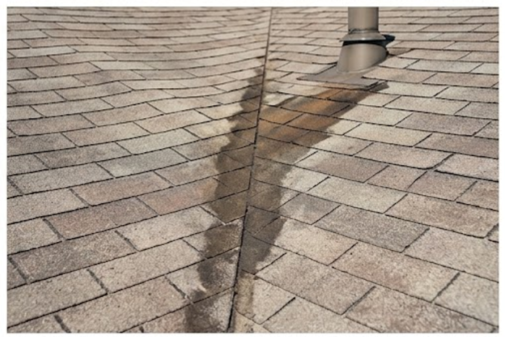 Signs of roof damage including missing shingles and worn areas